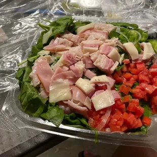 a salad in a plastic container