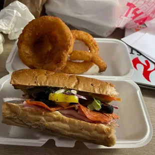 a sandwich and onion rings
