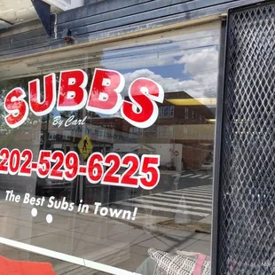 Carl's Subb's Window Sign.