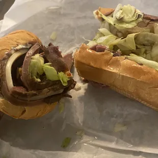 a sub sandwich with meat and lettuce
