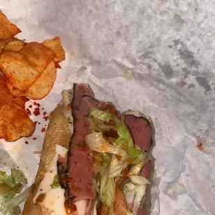 Turkey,pastrami,roast beef, &amp; provolone sub w/ everything on it .