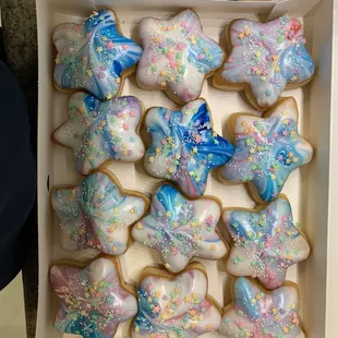 a box of decorated sugar cookies