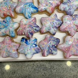 a box of decorated sugar cookies