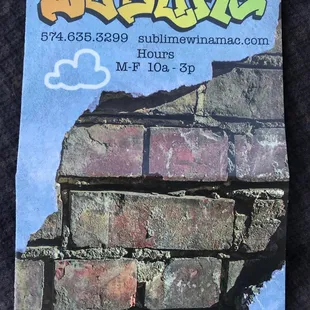 a brick wall with graffiti on it