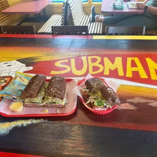 Subs and the subman, hand painted by the daughter of the business owner