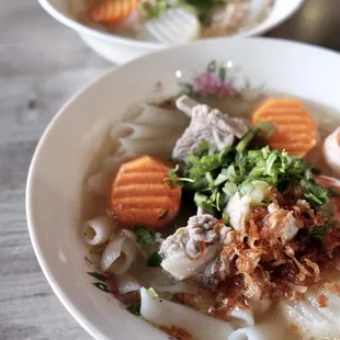 two bowls of soup on a table