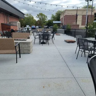 a patio with tables and chairs