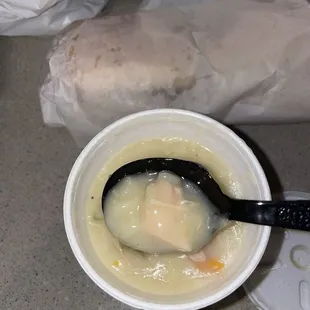 a bowl of soup with a spoon in it