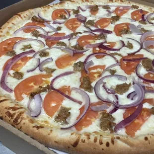 The Super White pizza! Olive oil and garlic base with mozzarella, tomato, ricotta, red onion, and sausage.