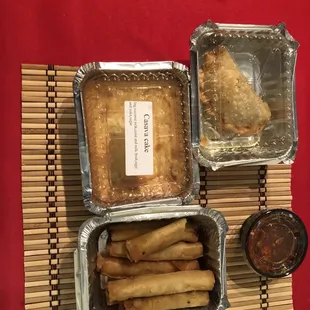 Chicken egg rolls, beef empanada and cassava cake