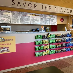 a woman standing in front of a counter