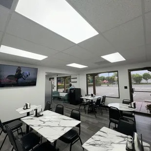 This is the waiting area or a cute place to sit and eat with your friend.