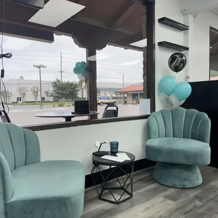 The front area of the restaurant features one table with two chairs.