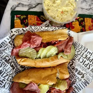 11" - 12" pastrami, cheese, dill pickles and mustard on toasted white roll and side of potato salad [tasted like "Reser's Original" brand]