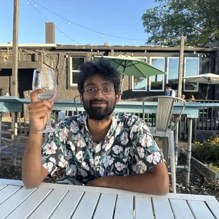 My friend Surya and his empty wine. It was a jammy sparkling wine and he loved it!