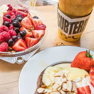 clockwise from top left: Subterranean Bowl (acai), Latte, and Brie Toast.