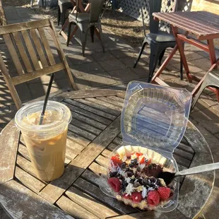 Iced white blackberry mocha with oat milk and acai bowl on the patio