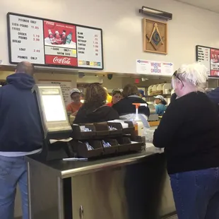 Condiment counter and pick up/order counter behind.