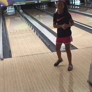 My daughter celebrating after knocking a few pins down. Notice the bumpers