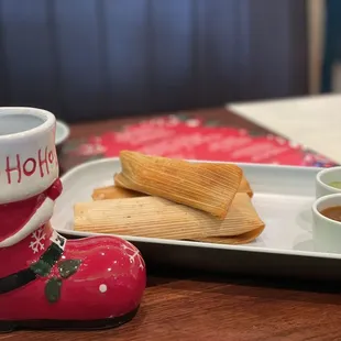 a plate of food and a cup of hot chocolate