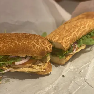 Turkey, cheese, pesto, garlic aioli, arugula, onions, toms, yum!!