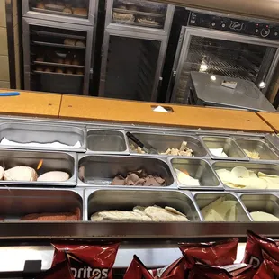 a variety of ice creams in a display case