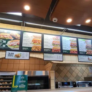 menus on the wall of a subway restaurant