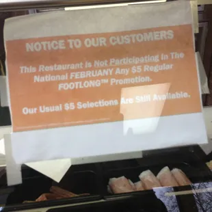 a sign stating customers not to buy food