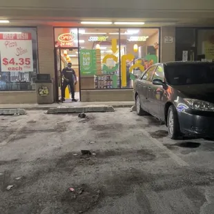 a car parked in front of a subway