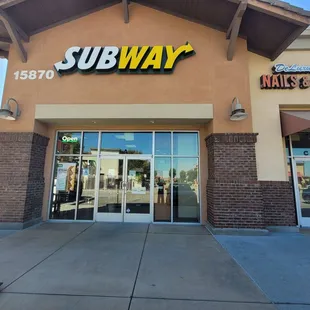 the entrance of a subway restaurant