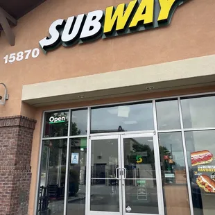 the entrance of a subway restaurant
