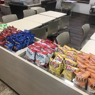 a snack counter with chips and chips in it