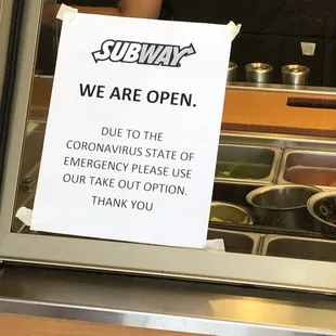 a sign in the window of a subway restaurant