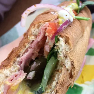 a half eaten sandwich on a plate