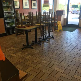 empty tables and chairs in a restaurant
