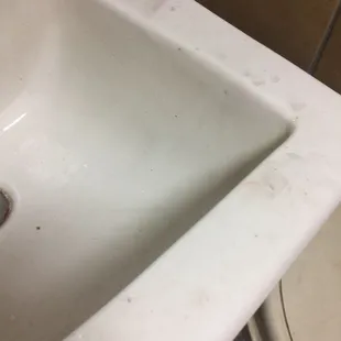 a dirty sink in a public restroom