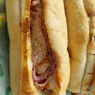 two hot dogs on a wrapper