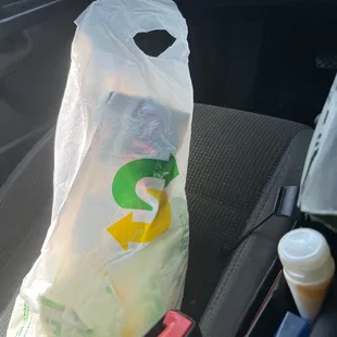 a plastic bag in the passenger seat of a car
