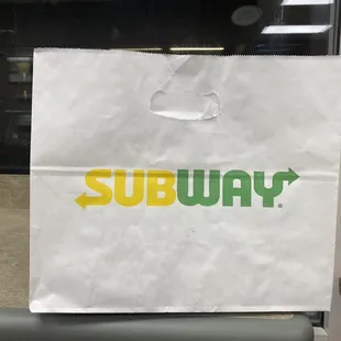 a paper bag with a dollar sign on it