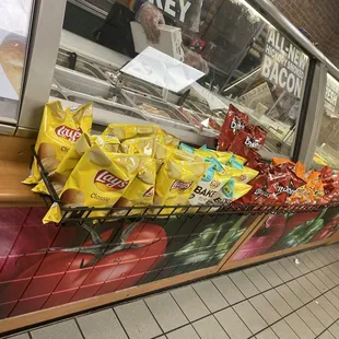 a display of chips and other snacks