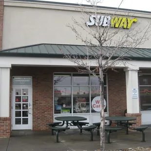 the entrance of a subway restaurant