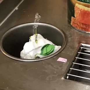 a can of canned food in a sink