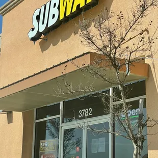 the entrance of a subway restaurant