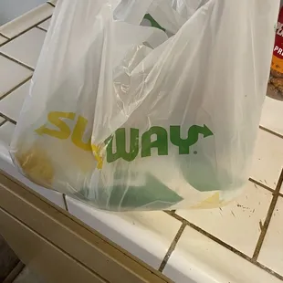 a plastic bag with the word subway on it