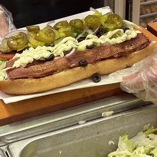 a hot dog on a bun with toppings