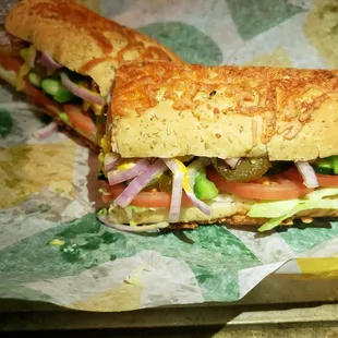 a sub sandwich on a piece of wax paper