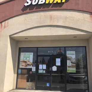 the entrance to a subway restaurant