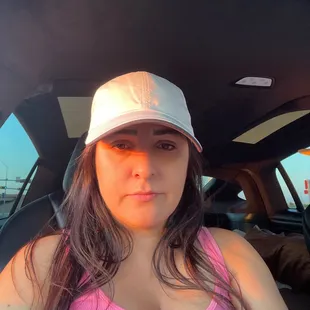 a woman sitting in the back seat of a car