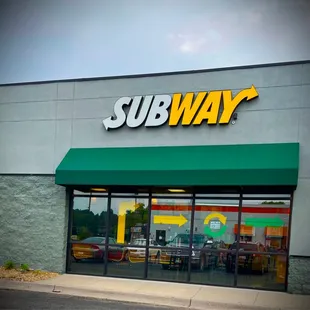 the entrance of a subway restaurant
