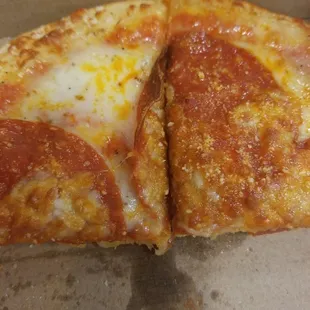 a half eaten pizza in a box